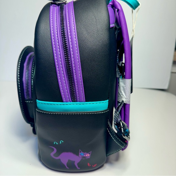 NWT. Loungefly Disney\'s The Haunted Mansion Madame Leota Mini Backpack glows main image 16